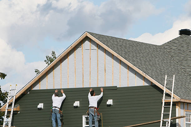 Professional Siding Installation technician working in Reedsville, PA